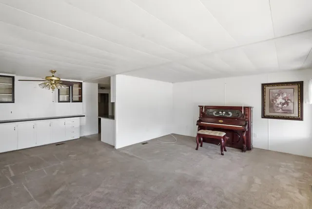 a kitchen with stainless steel appliances granite countertop a stove and a sink with cabinets
