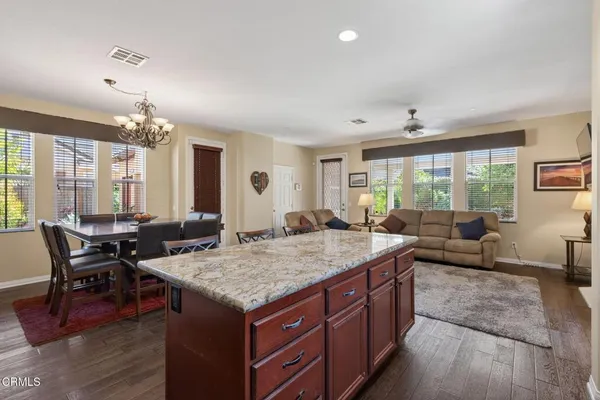 a view of a kitchen and dining room
