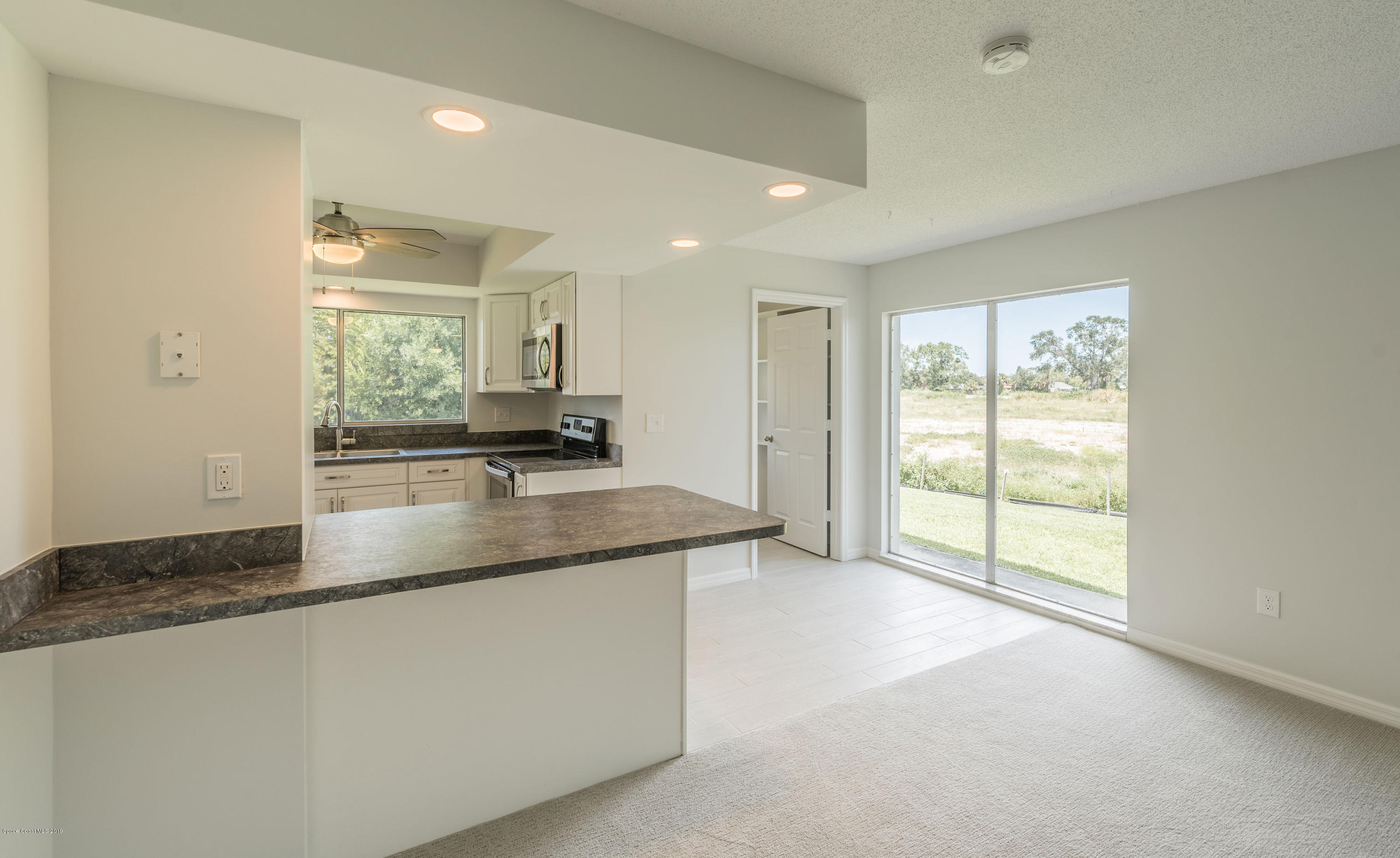 1449 Meadowbrook Road Northeast Palm Bay, FL 32905 - Photo 14 of 34 Breakfast Bar & Nook