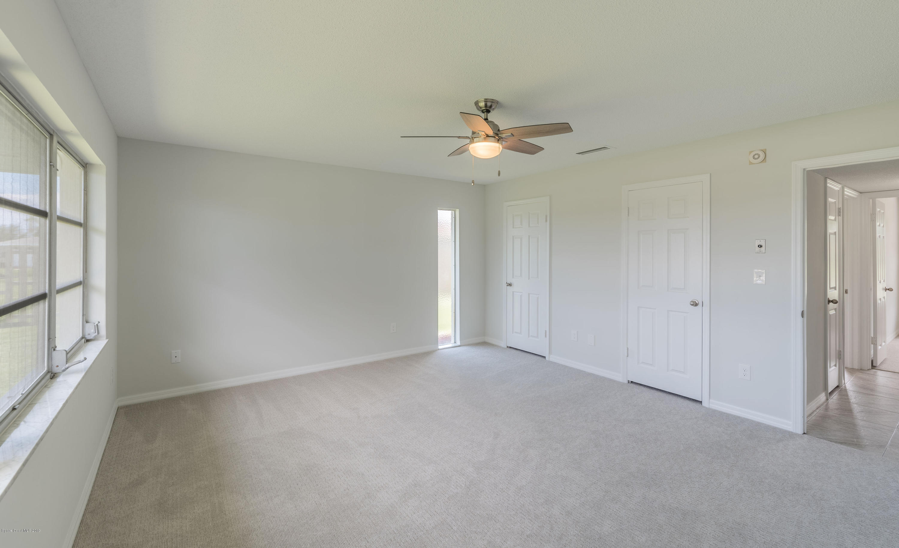 1449 Meadowbrook Road Northeast Palm Bay, FL 32905 - Photo 19 of 34 Master Bedroom
