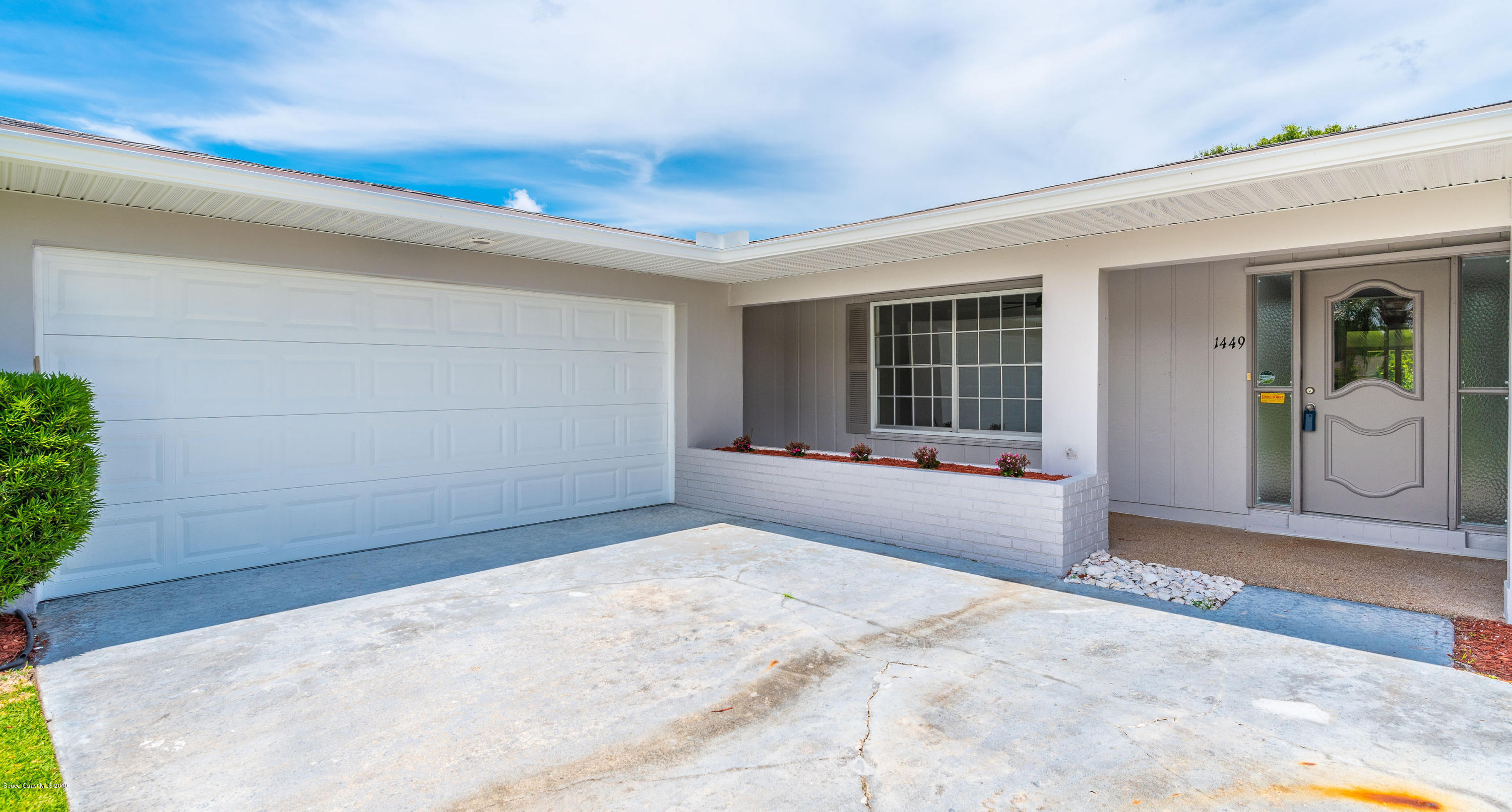 1449 Meadowbrook Road Northeast Palm Bay, FL 32905 - Photo 3 of 34 Garage and Front Porch