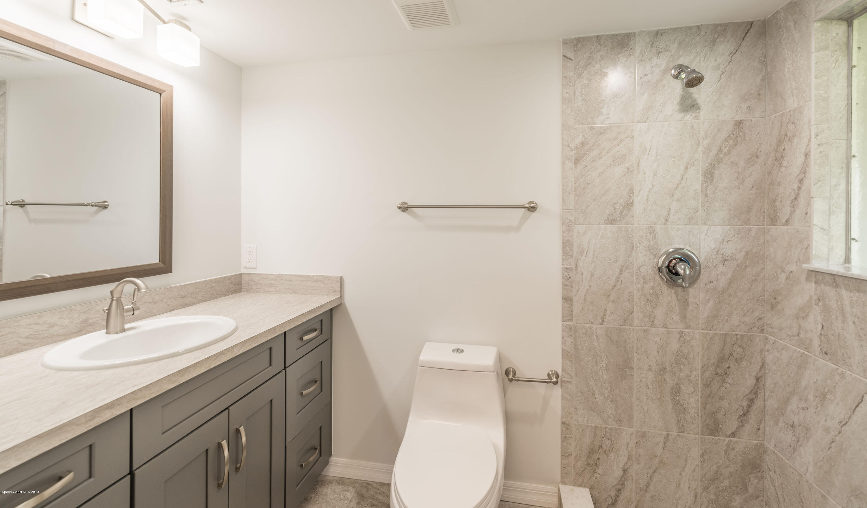 1449 Meadowbrook Road Northeast Palm Bay, FL 32905 - Photo 21 of 34 Guest Shower/Second Vanity