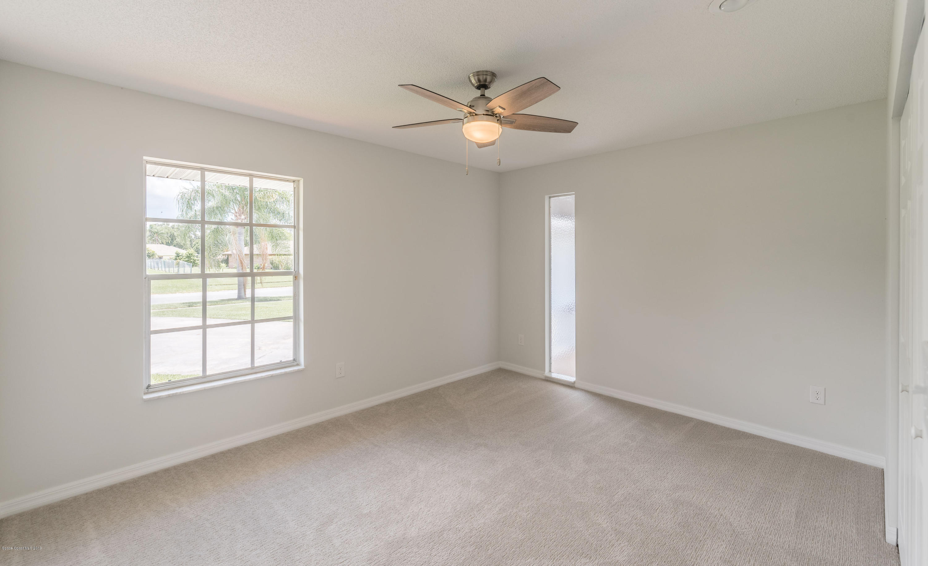 1449 Meadowbrook Road Northeast Palm Bay, FL 32905 - Photo 25 of 34 Bedroom 3