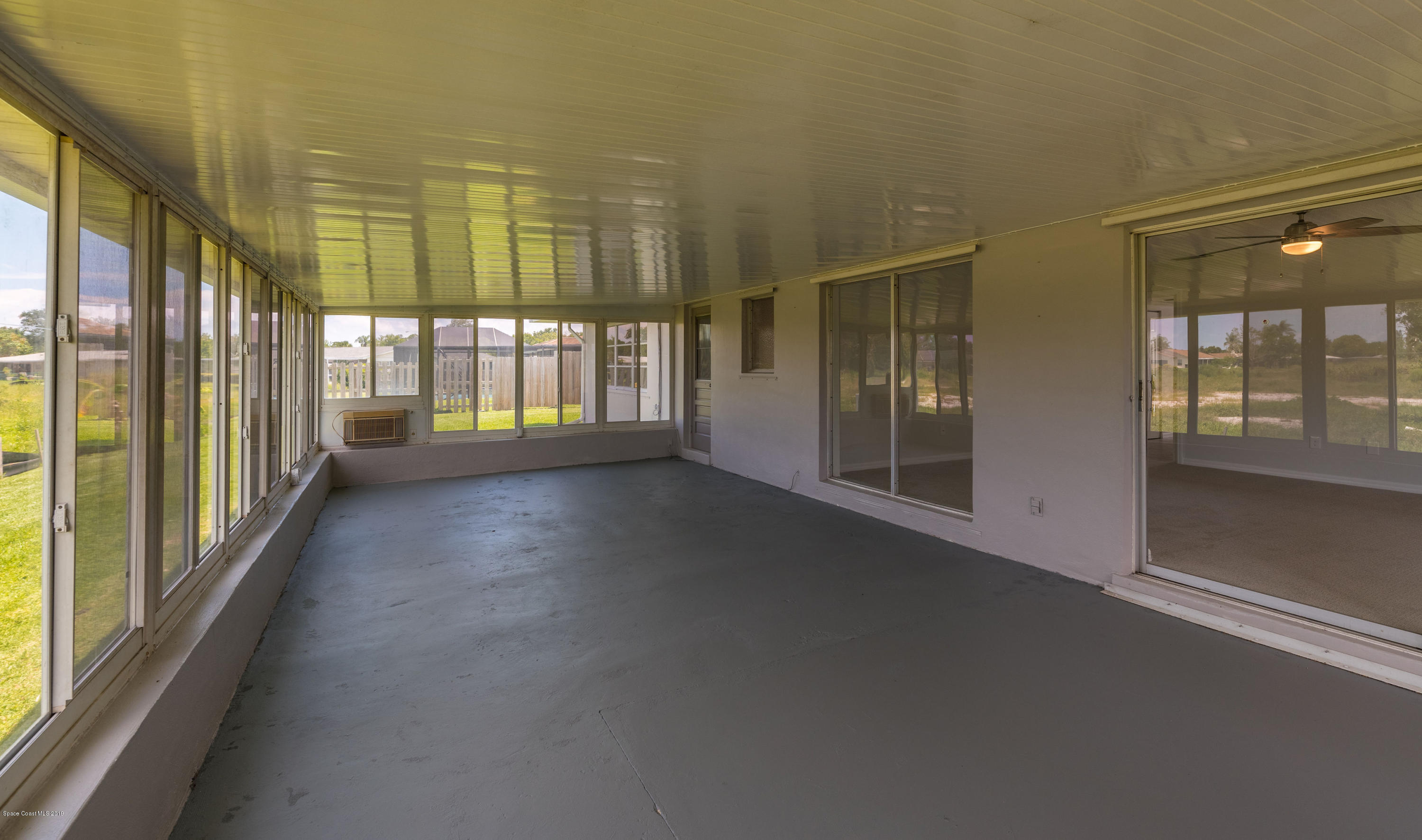1449 Meadowbrook Road Northeast Palm Bay, FL 32905 - Photo 26 of 34 Enclosed Porch