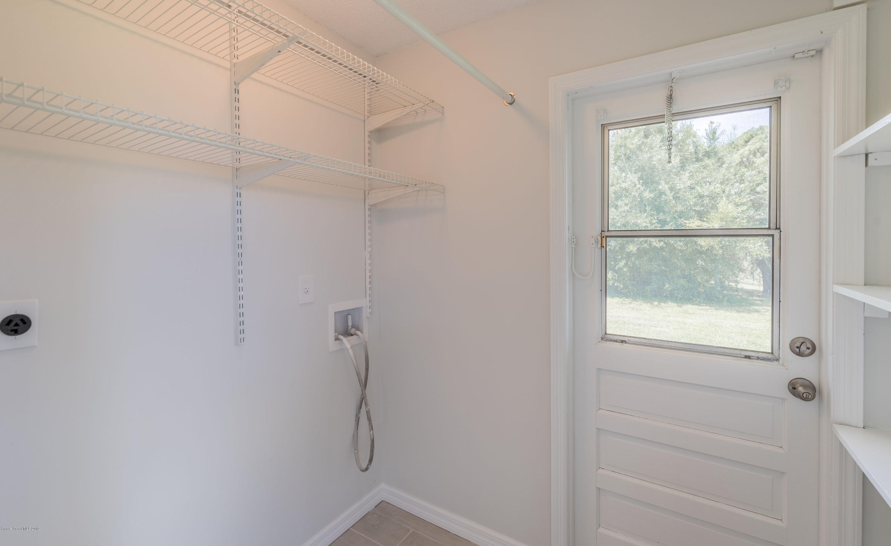 1449 Meadowbrook Road Northeast Palm Bay, FL 32905 - Photo 27 of 34 Laundry Room