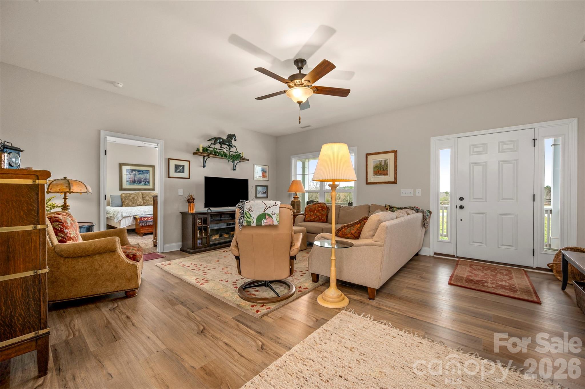 398 David Sims Road Rutherfordton, NC 28139 - Photo 10 of 48 a living room with furniture a fireplace and a flat screen tv
