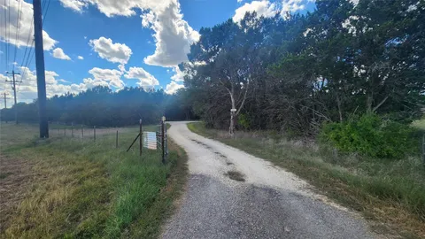 a view of a road with a yard