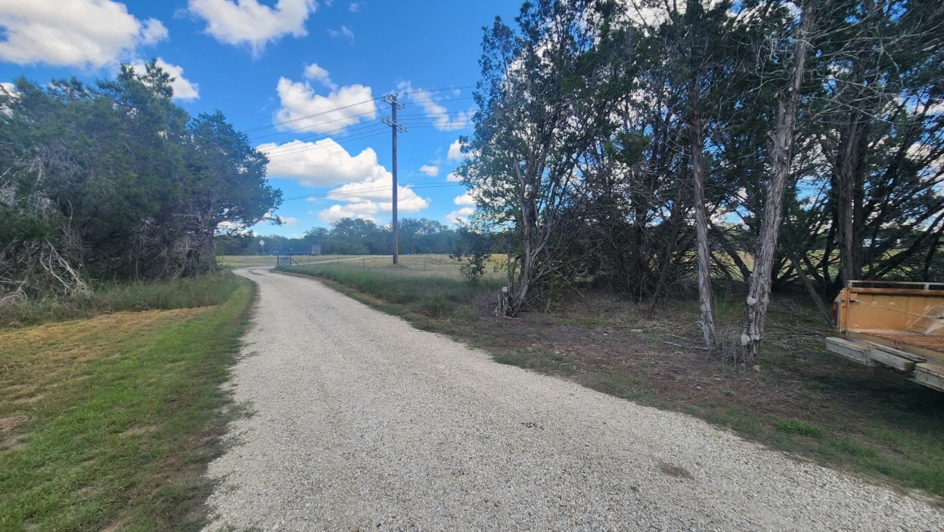 25615 Ronald Reagan Boulevard Georgetown, TX 78633 - Photo 16 of 25 a view of a road with a yard