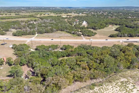 an aerial view of a houses with a yard