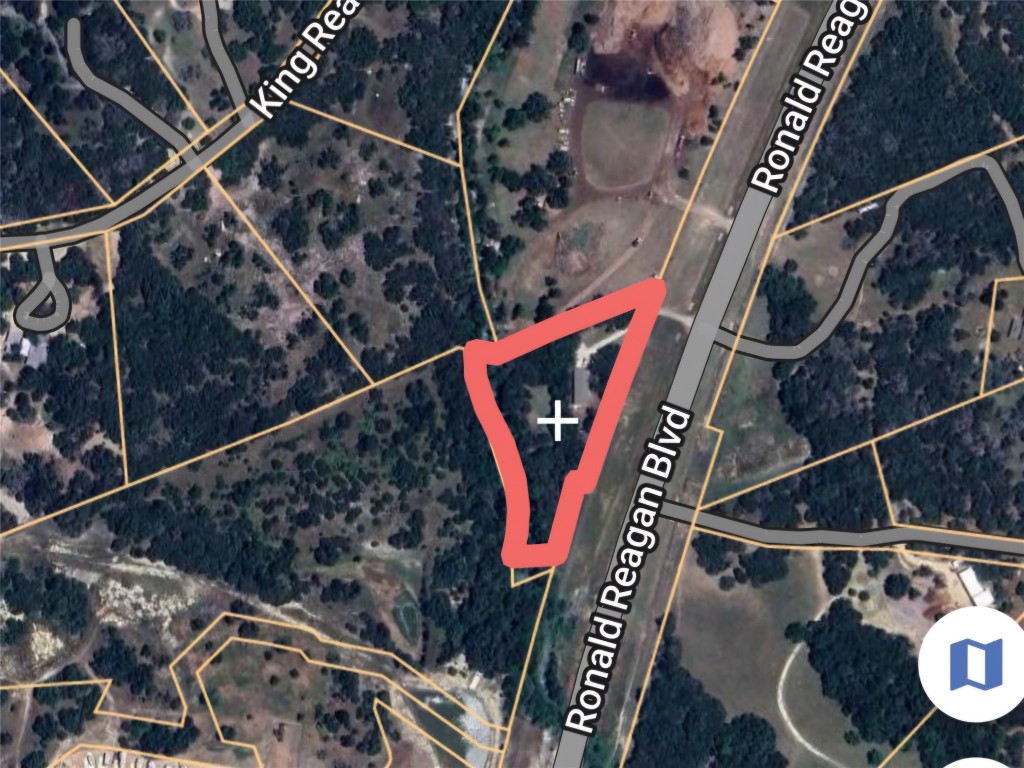 25615 Ronald Reagan Boulevard Georgetown, TX 78633 - Photo 9 of 25 a utility room with lots of water heater and wooden floor