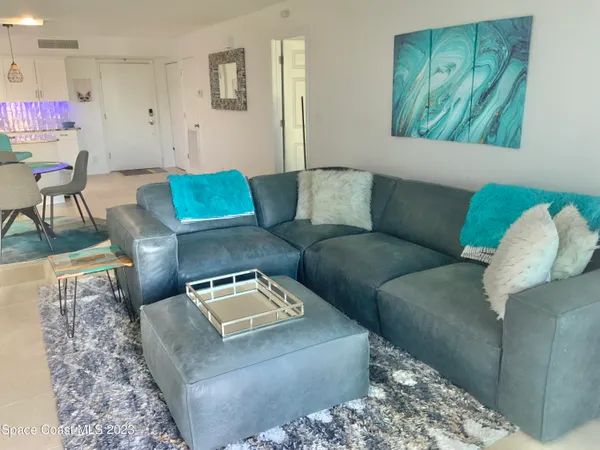 a living room with furniture and a couch