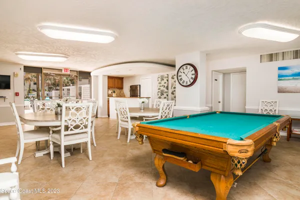 a room with furniture and a clock