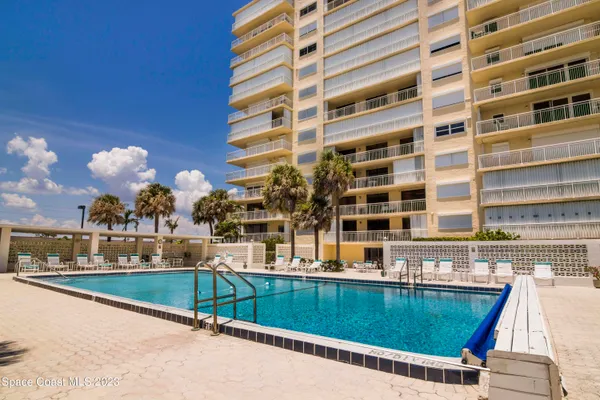 a view of building with swimming pool