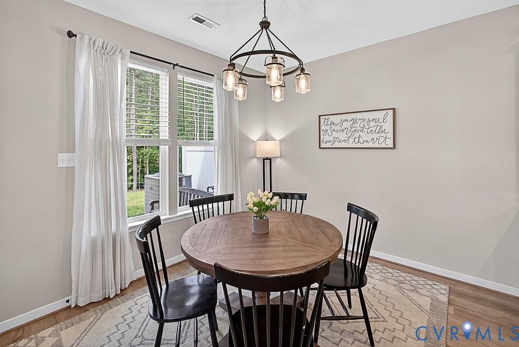 18517 Palisades Ridge Moseley, VA 23120 - Photo 10 of 55 a view of a dining room with furniture window and wooden floor