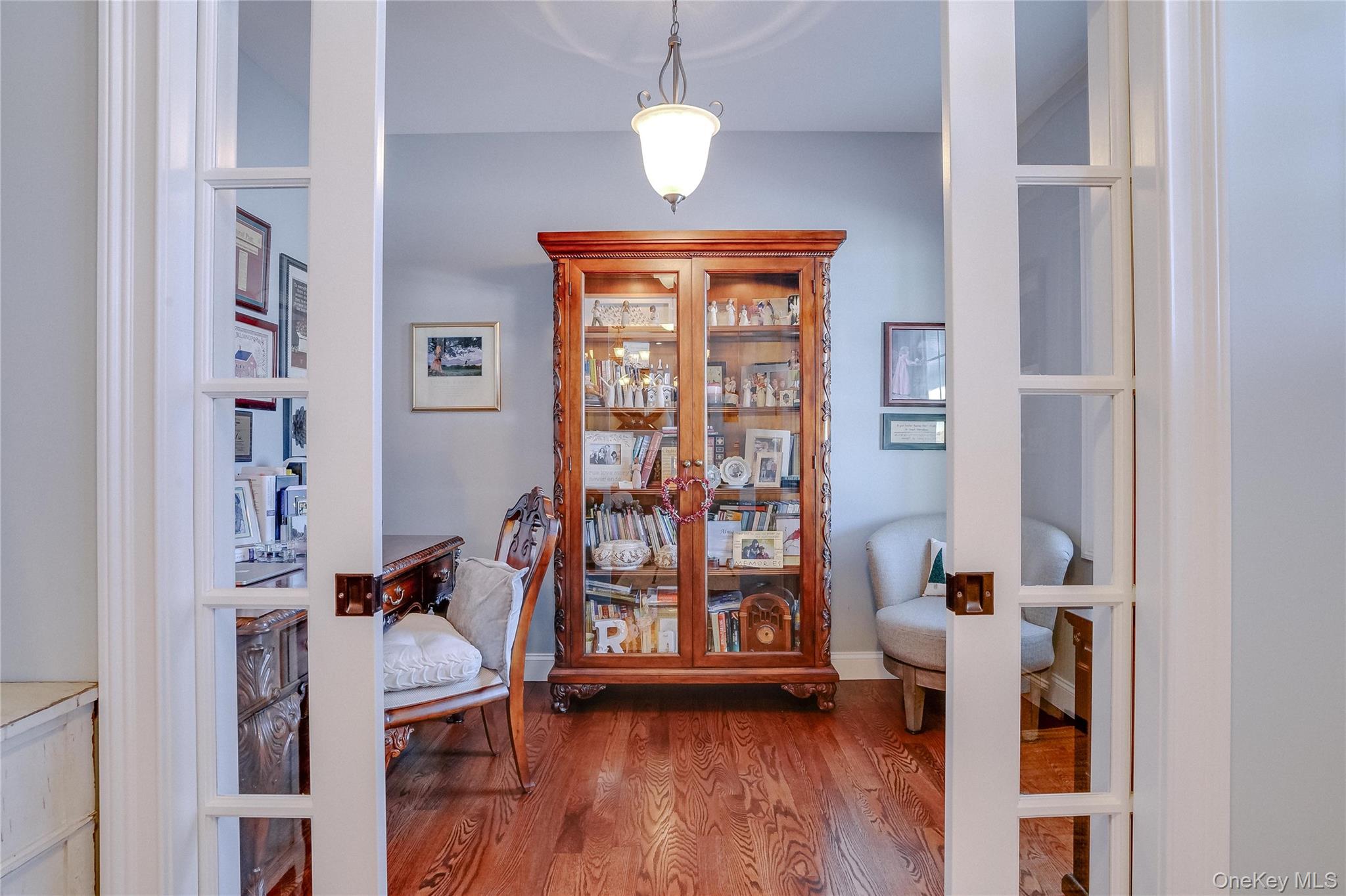 23 Swan Holw Road New Windsor, NY 12553 - Photo 9 of 34 A beautiful office just off the foyer features rich hardwood floors and custom trim, offering a quiet and stylish space ideal for working from home, studying, or managing daily tasks.