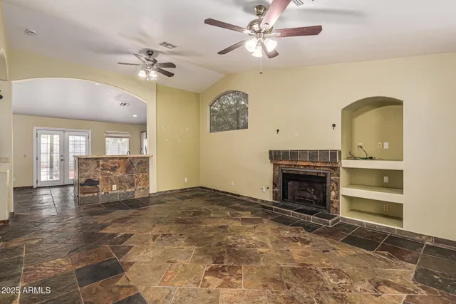 a spacious bathroom with a mirror and a shower