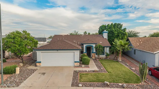 an aerial view of a house with outdoor space