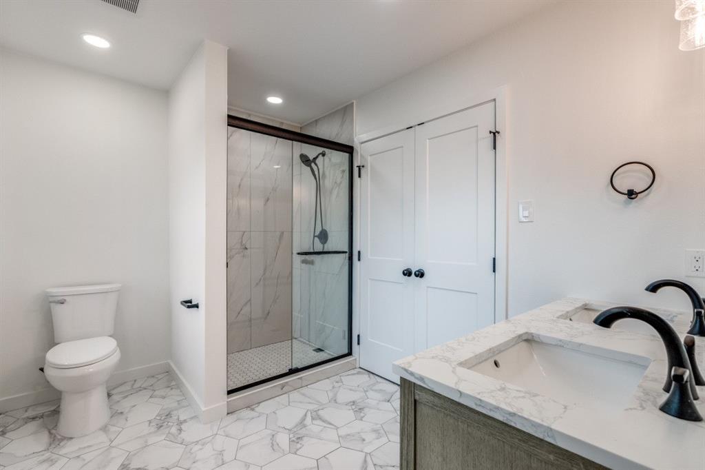 109 East 5th Street Prosper, TX 75078 - Photo 15 of 25 a bathroom with a sink toilet and shower
