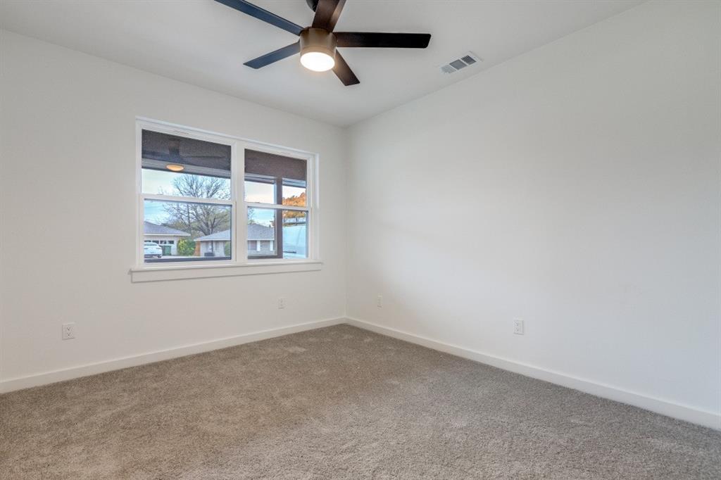 109 East 5th Street Prosper, TX 75078 - Photo 18 of 25 an empty room with a window and a fan