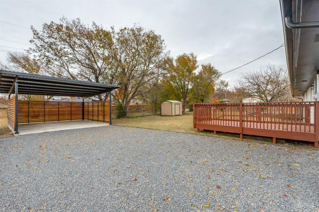 109 East 5th Street Prosper, TX 75078 - Photo 21 of 25 a view of backyard with deck and a garden