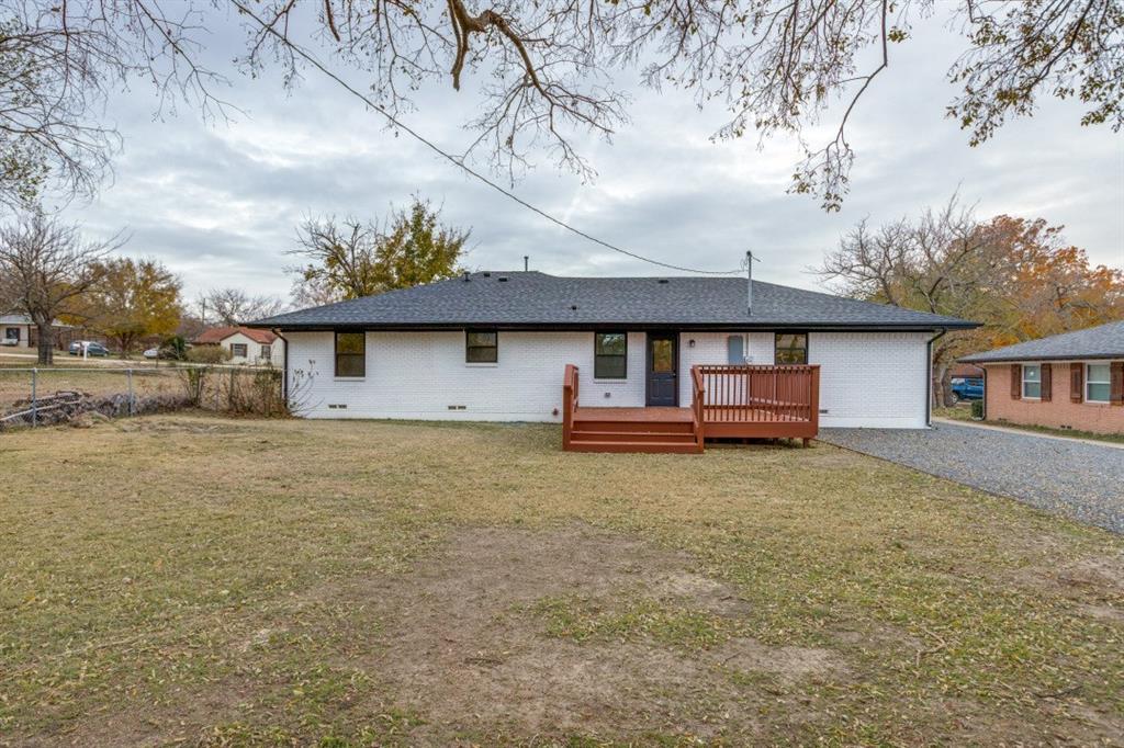 109 East 5th Street Prosper, TX 75078 - Photo 22 of 25 a backyard of a house with barbeque oven table and chairs