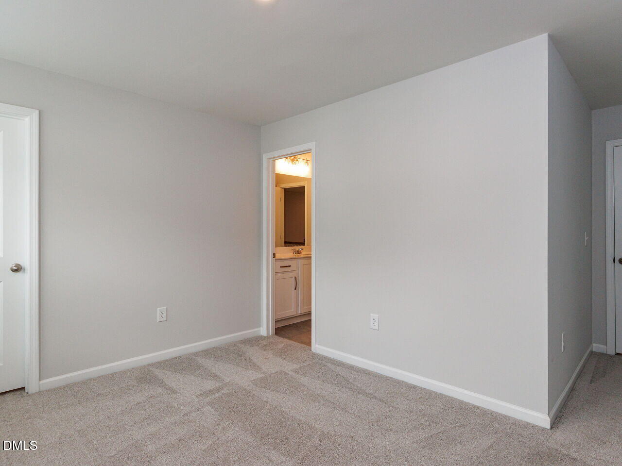 3112 Ranger Drive Durham, NC 27703 - Photo 19 of 35 a view of an empty room with wooden floor and a window