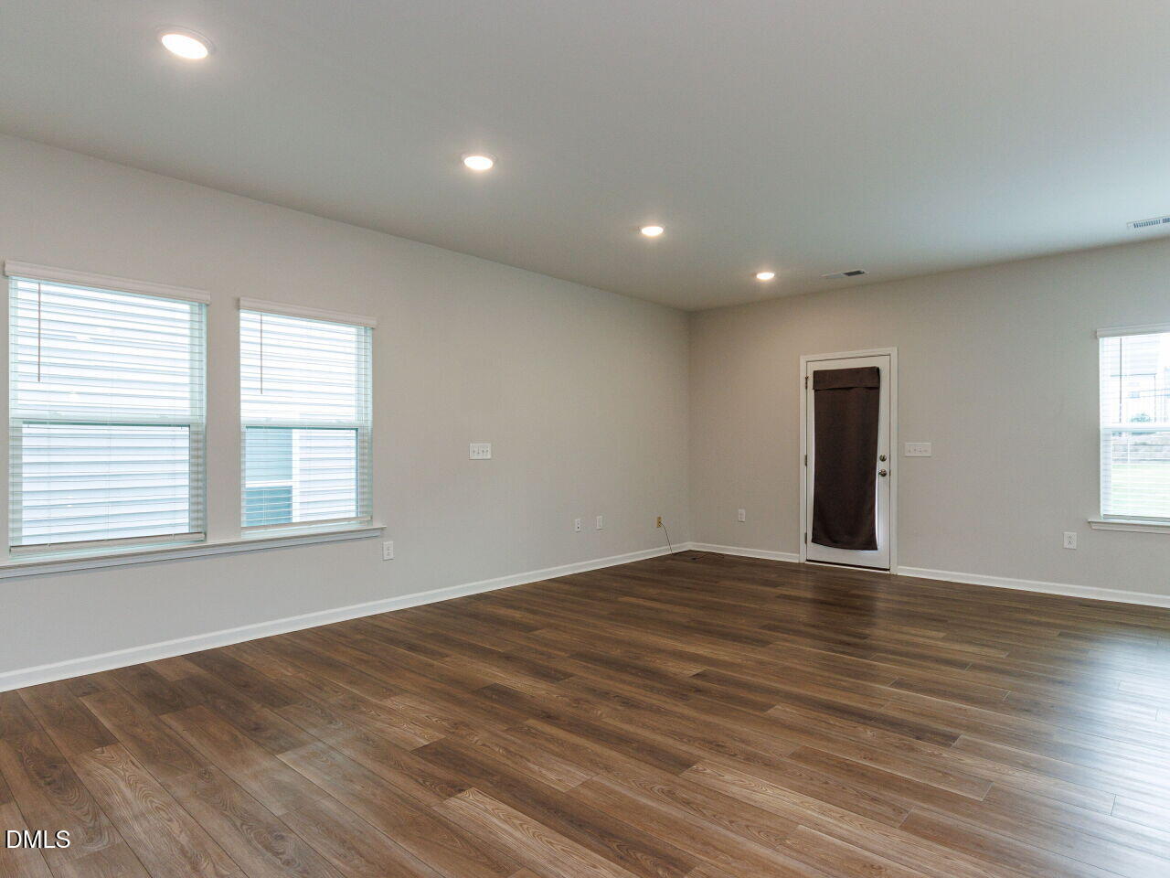 3112 Ranger Drive Durham, NC 27703 - Photo 28 of 35 an empty room with wooden floor and windows