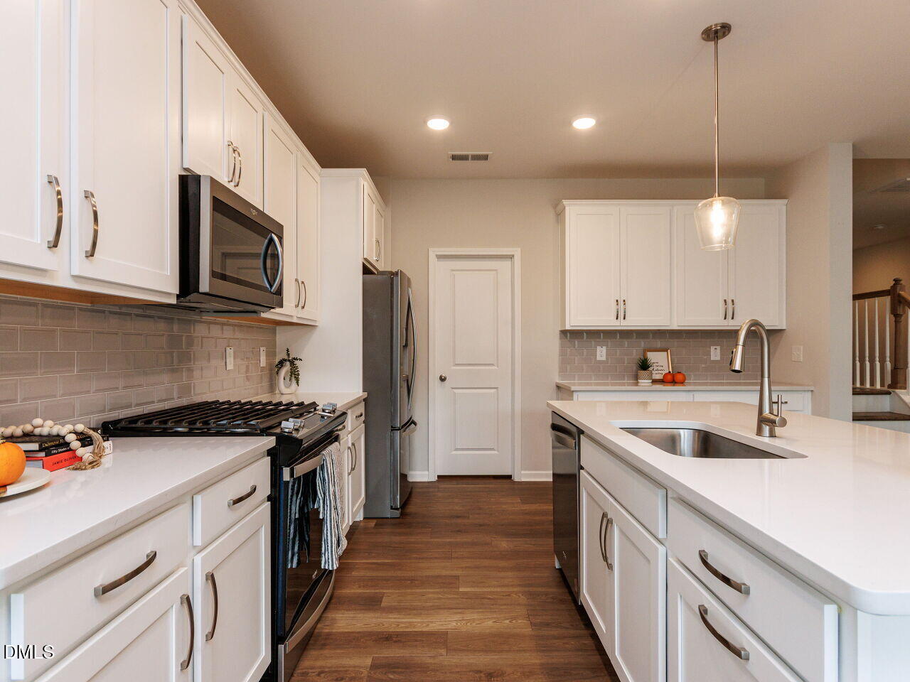 3112 Ranger Drive Durham, NC 27703 - Photo 6 of 35 a kitchen with a sink stove top oven and refrigerator
