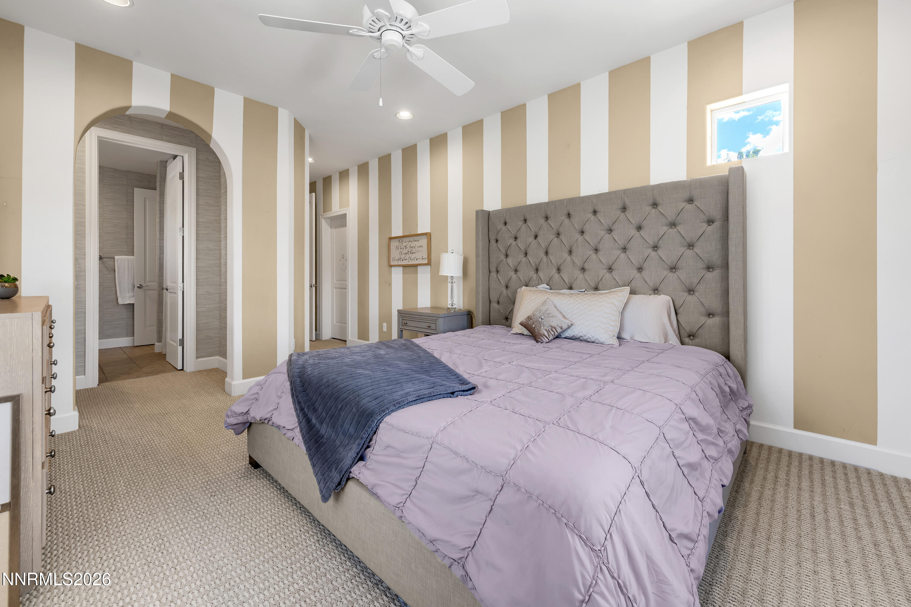 1898 Laurel Ridge Drive Reno, NV 89523 - Photo 59 of 87 a bedroom with a large bed and a chandelier