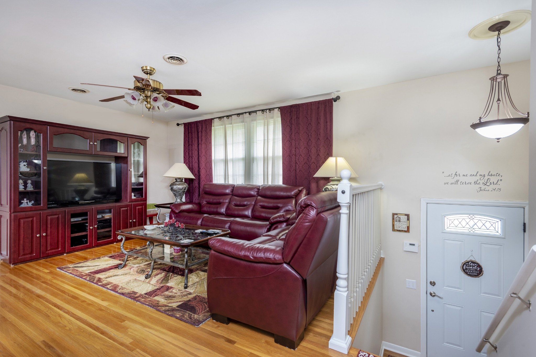 8416 Terry Lane Hermitage, TN 37076 - Photo 2 of 24 a living room with furniture a flat screen tv and a window
