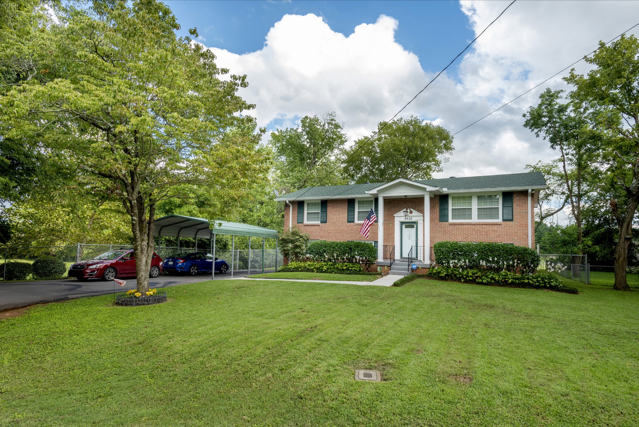 8416 Terry Lane Hermitage, TN 37076 - Photo 19 of 24 a view of a house with a yard and tree s