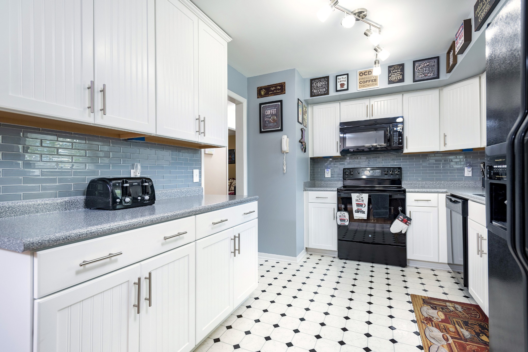 8416 Terry Lane Hermitage, TN 37076 - Photo 6 of 24 a kitchen with stainless steel appliances kitchen island granite countertop a refrigerator sink and stove