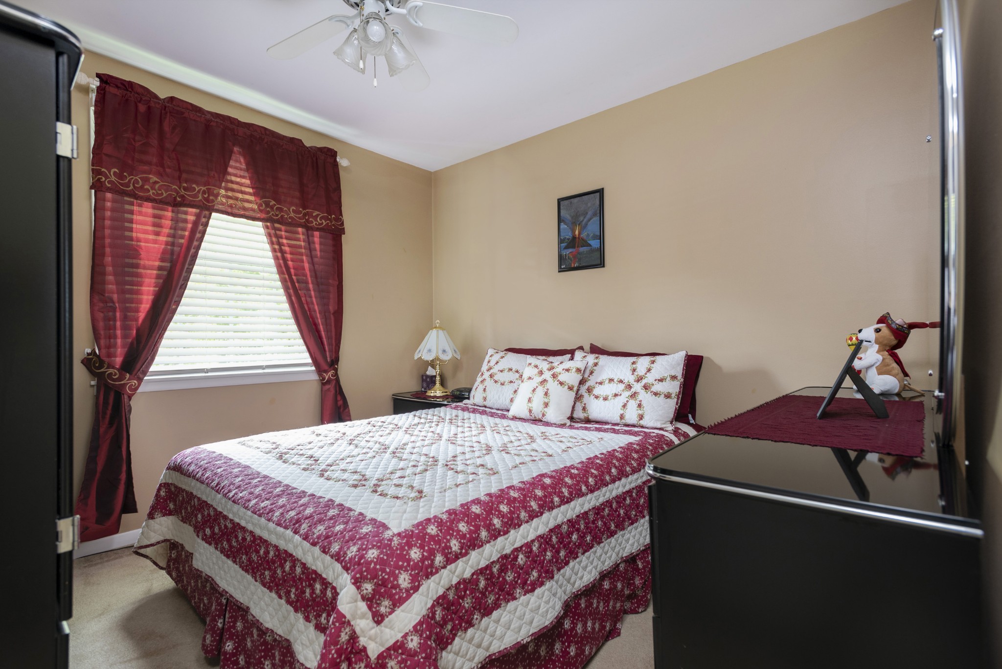 8416 Terry Lane Hermitage, TN 37076 - Photo 9 of 24 a bedroom with a bed and a chandelier