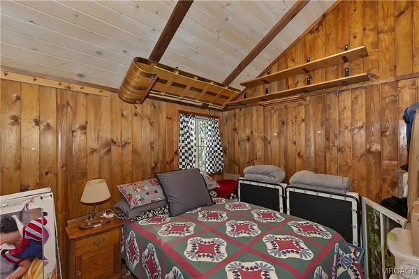 a bedroom with a bed and a table