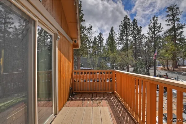 a view of balcony with wooden floor