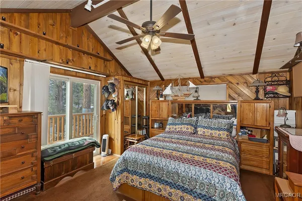 a bed room with a bed and a chandelier