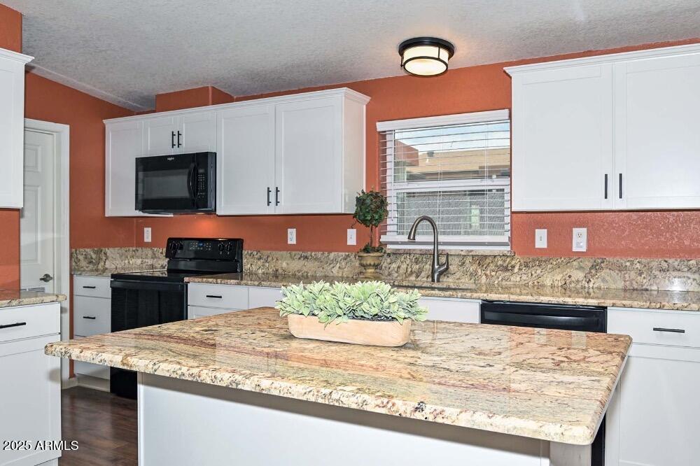 16101 North El Mirage Road, Unit 322 El Mirage, AZ 85335 - Photo 13 of 50 a kitchen with stainless steel appliances granite countertop a sink stove and refrigerator