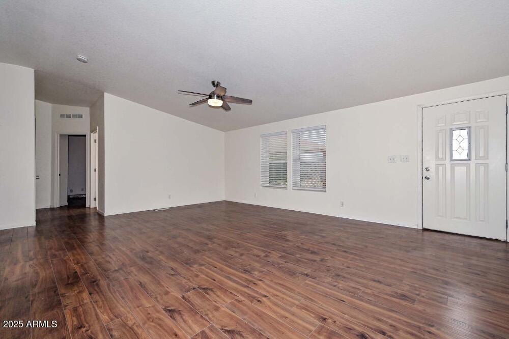 16101 North El Mirage Road, Unit 322 El Mirage, AZ 85335 - Photo 17 of 50 a view of empty room with wooden floor and fan