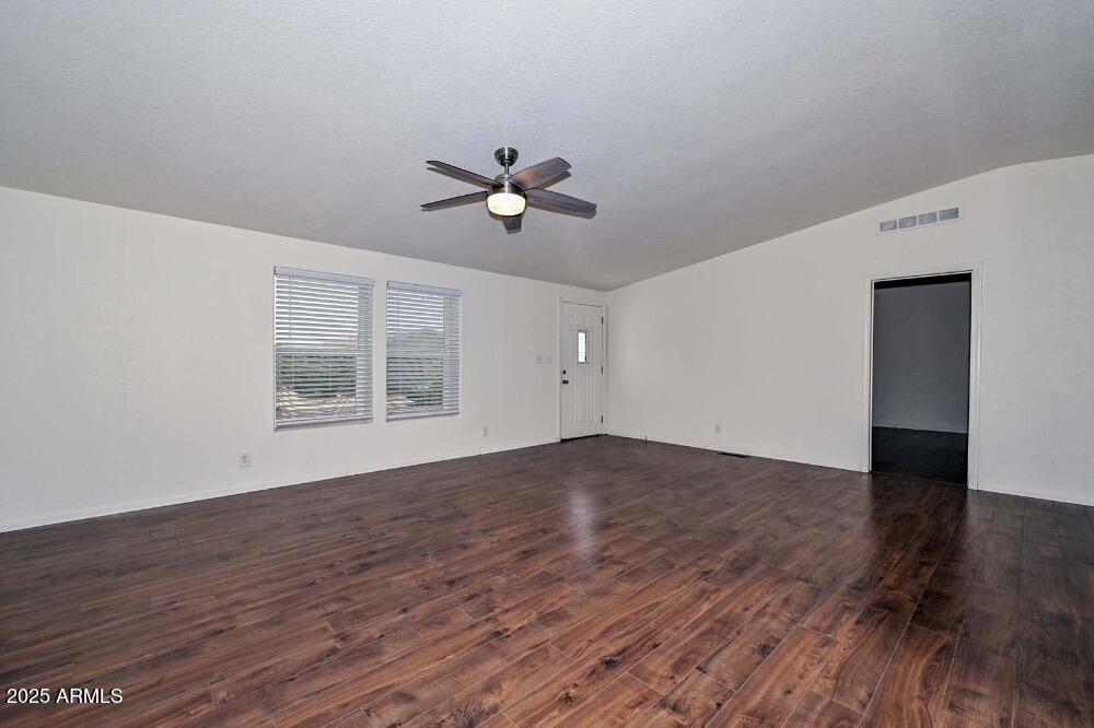 16101 North El Mirage Road, Unit 322 El Mirage, AZ 85335 - Photo 18 of 50 a view of empty room with wooden floor and fan