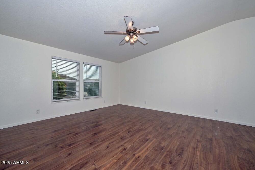 16101 North El Mirage Road, Unit 322 El Mirage, AZ 85335 - Photo 22 of 50 wooden floor in an empty room with a window
