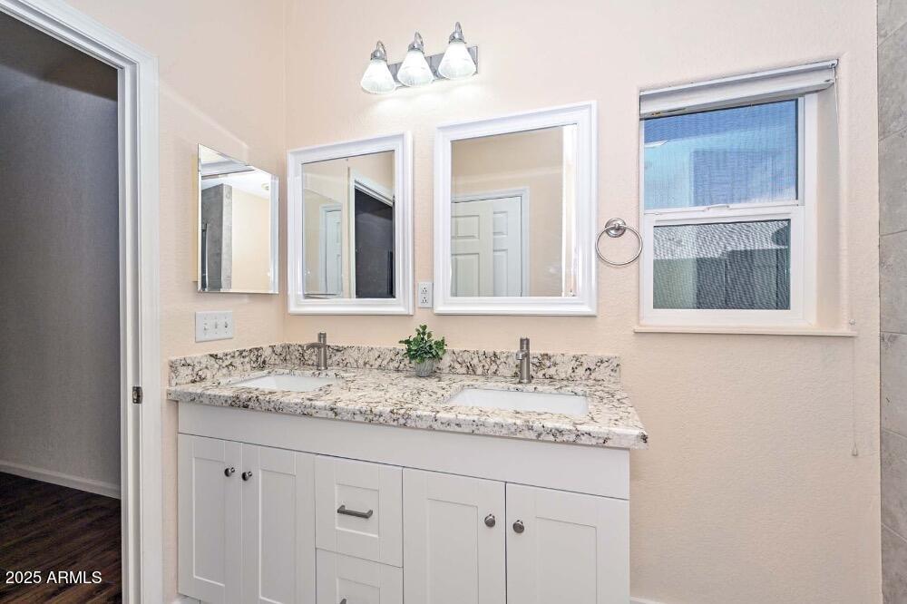 16101 North El Mirage Road, Unit 322 El Mirage, AZ 85335 - Photo 25 of 50 a bathroom with a sink and a mirror