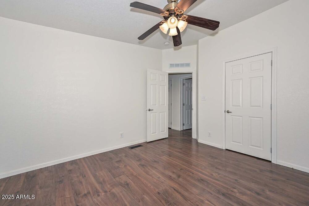 16101 North El Mirage Road, Unit 322 El Mirage, AZ 85335 - Photo 29 of 50 a view of an empty room with wooden floor