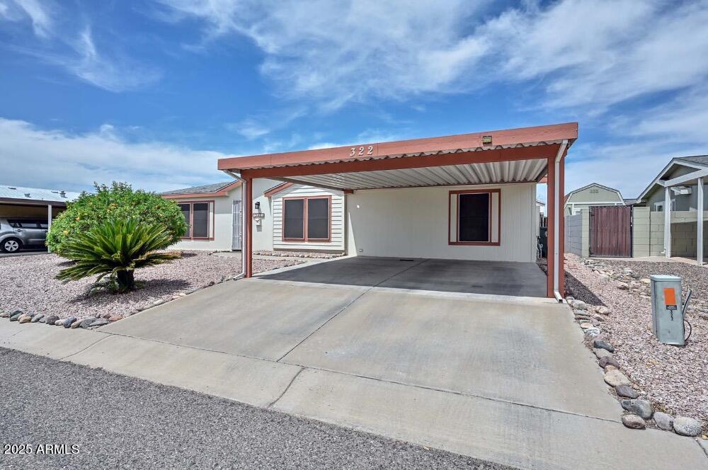 16101 North El Mirage Road, Unit 322 El Mirage, AZ 85335 - Photo 3 of 50 a view of a house with a patio