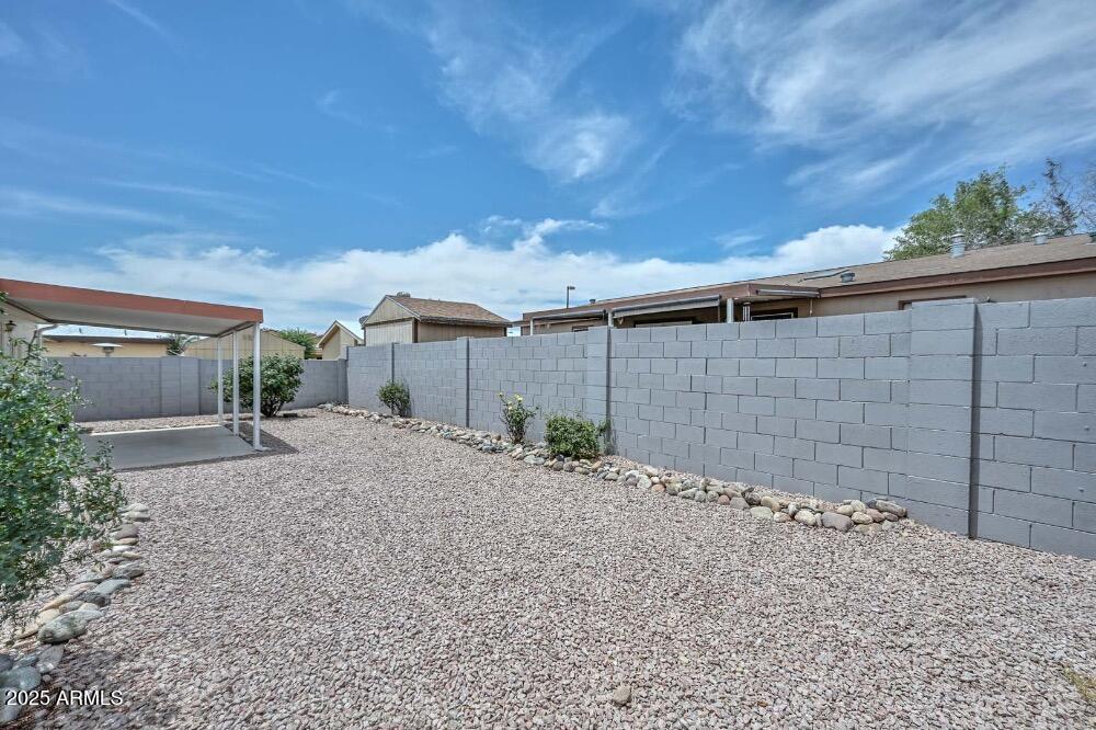 16101 North El Mirage Road, Unit 322 El Mirage, AZ 85335 - Photo 39 of 50 a backyard of a house