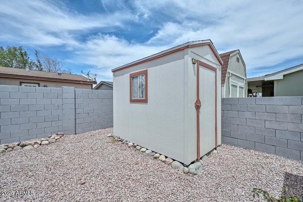 16101 North El Mirage Road, Unit 322 El Mirage, AZ 85335 - Photo 40 of 50 a backyard of a house
