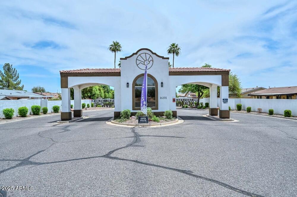 16101 North El Mirage Road, Unit 322 El Mirage, AZ 85335 - Photo 43 of 50 front view of a house with a street