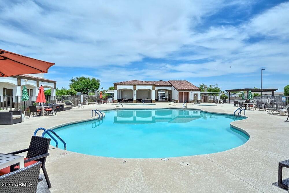 16101 North El Mirage Road, Unit 322 El Mirage, AZ 85335 - Photo 45 of 50 a view of a house with swimming pool