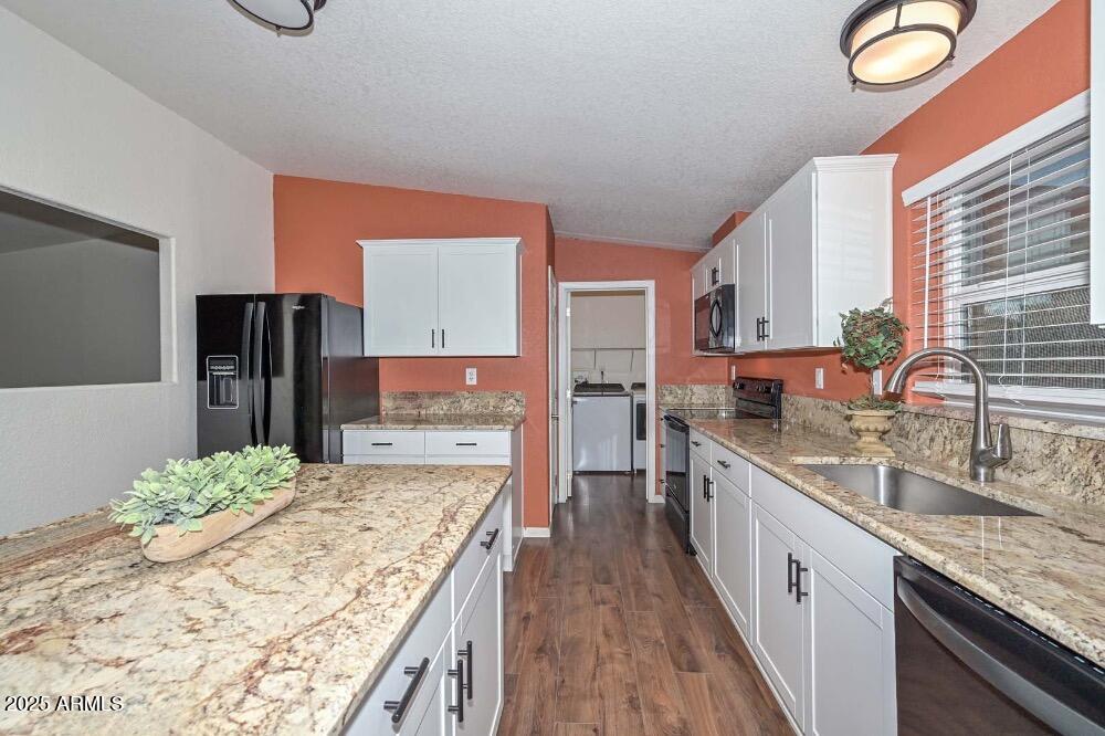 16101 North El Mirage Road, Unit 322 El Mirage, AZ 85335 - Photo 10 of 50 a large kitchen with stainless steel appliances kitchen island granite countertop a sink and cabinets