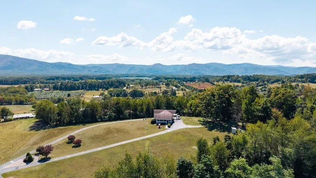 a view of living room with furniture and floor to ceiling window