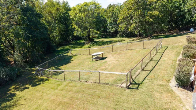 a kitchen with granite countertop a sink and white stainless steel appliances